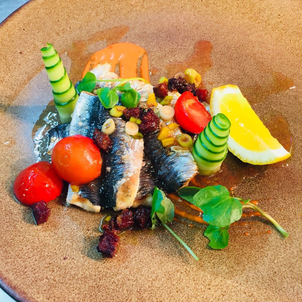 grilled sardines, chorizo, cherry tomato salsa at the crab and lobster